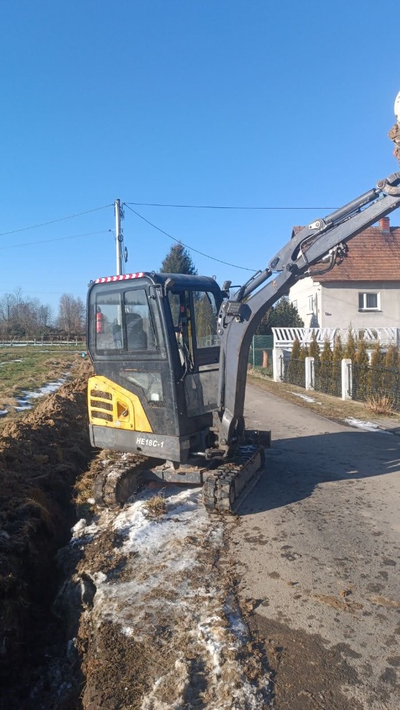Mini excavator working on fiber line